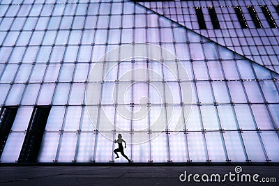 Young Girl Runninging by Chongqing Grand theater at night Editorial Stock Photo